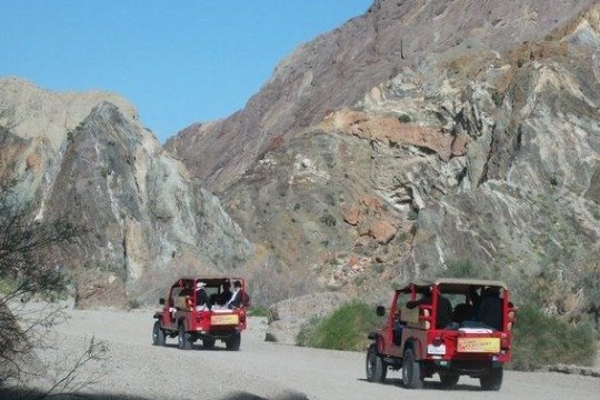 a truck driving down a mountain road